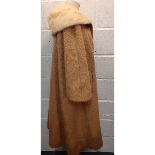 77 - A mid 20th Century American B.Forman & Co tan boucle lambswool swing ladies coat having an arctic mi... 