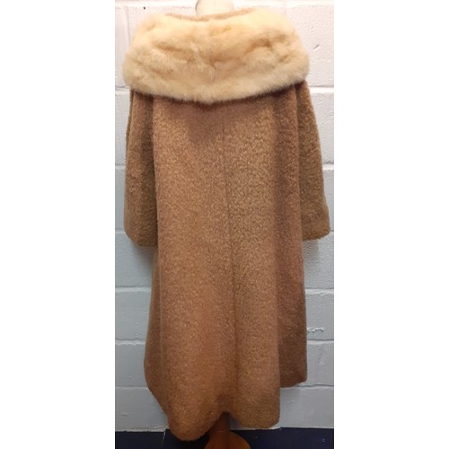 77 - A mid 20th Century American B.Forman & Co tan boucle lambswool swing ladies coat having an arctic mi... 