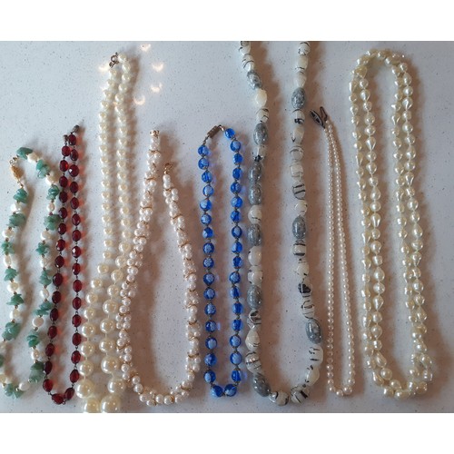 79 - A quantity of costume jewellery to include a late 20th Century Trifari faux pearl twist necklace, a ... 