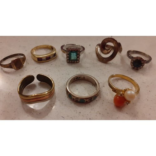 84 - A group of 8 modern dress rings to include a silver gilt ladies signet ring and a yellow metal ring ... 