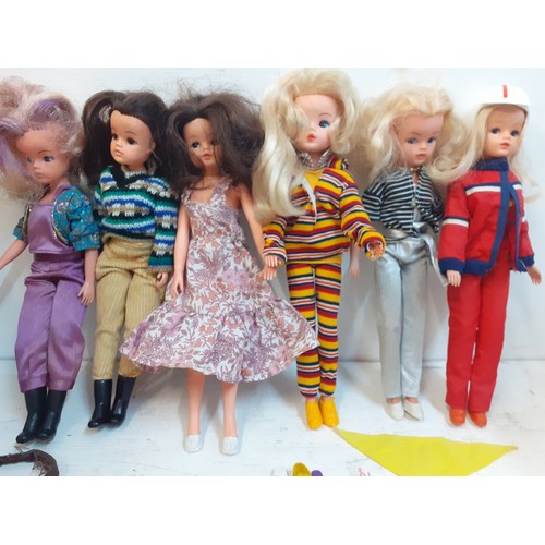 52 - Six 1980's Sindy dolls stamped 033055X to the rear of the neck wearing clothing and footwear togethe... 