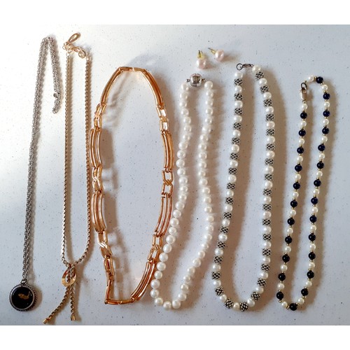 85 - Six necklaces to include a simulated pearl and blue bead necklace having a 9ct gold clasp stamped 37... 