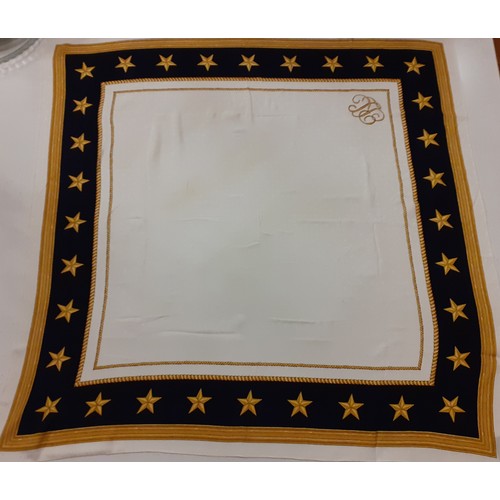 87 - Ralph Lauren- A silk scarf having a cream background with subtle anchor design, wide navy border wit... 