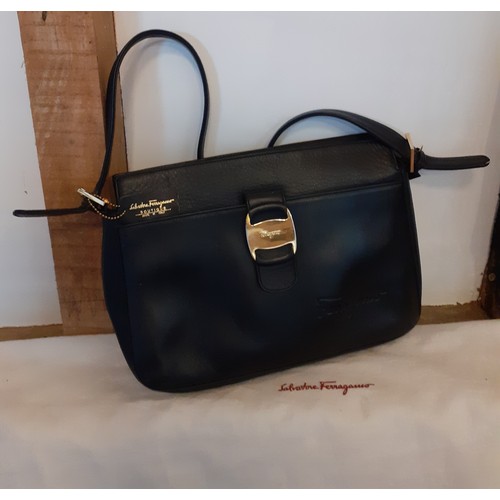 89 - Salvatore Ferragamo- A 'Boutique' black leather shoulder bag with gold tone hardware having an outer... 