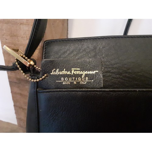 89 - Salvatore Ferragamo- A 'Boutique' black leather shoulder bag with gold tone hardware having an outer... 