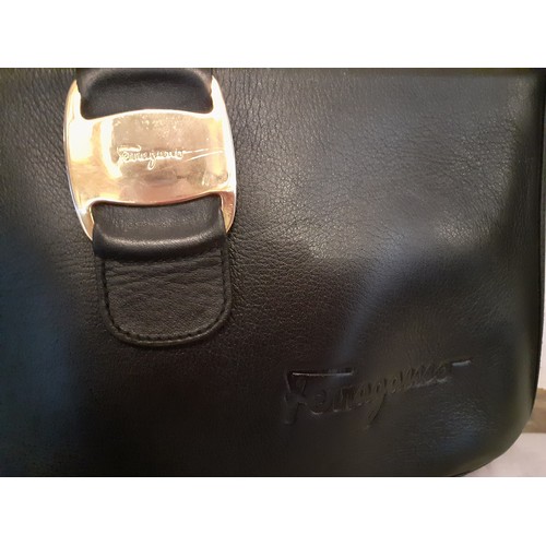 89 - Salvatore Ferragamo- A 'Boutique' black leather shoulder bag with gold tone hardware having an outer... 