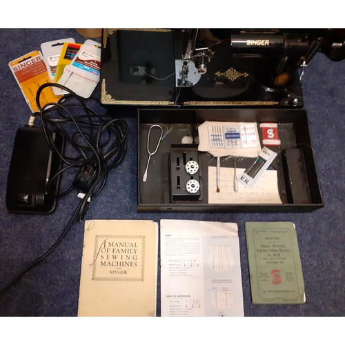 13 - A Singer 221K portable electric sewing machine serial no:EG964223 with manual, accessories and black... 