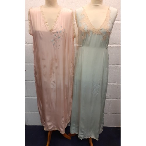 98 - A group of mid 20th Century silk night gowns in various colours and designs, together with a later b... 