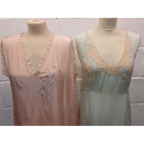 98 - A group of mid 20th Century silk night gowns in various colours and designs, together with a later b... 