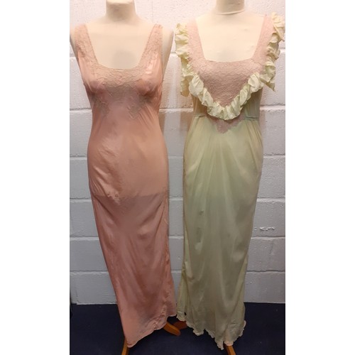 98 - A group of mid 20th Century silk night gowns in various colours and designs, together with a later b... 