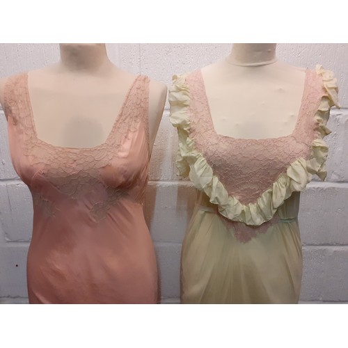 98 - A group of mid 20th Century silk night gowns in various colours and designs, together with a later b... 