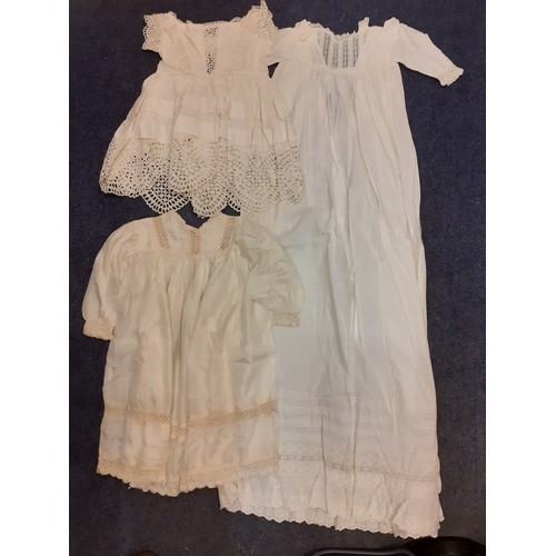 122 - Early 20th Century children's clothing to include white cotton christening dresses, a cream silk gir... 