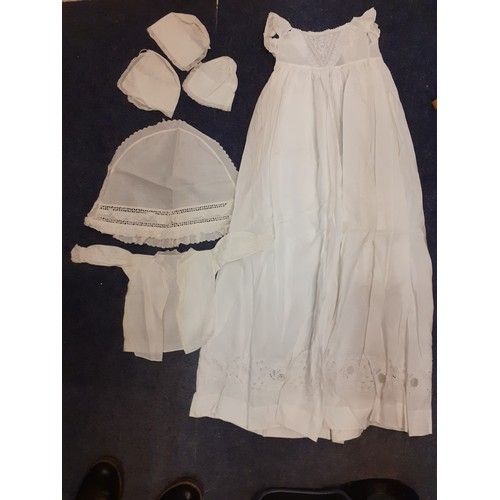 122 - Early 20th Century children's clothing to include white cotton christening dresses, a cream silk gir... 