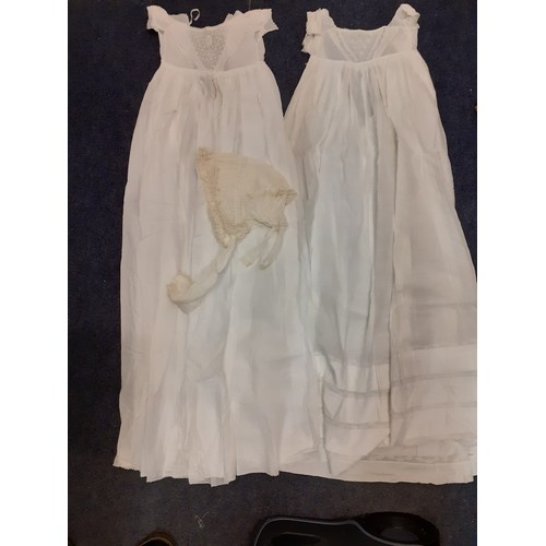 122 - Early 20th Century children's clothing to include white cotton christening dresses, a cream silk gir... 