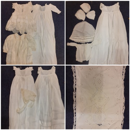 122 - Early 20th Century children's clothing to include white cotton christening dresses, a cream silk gir... 