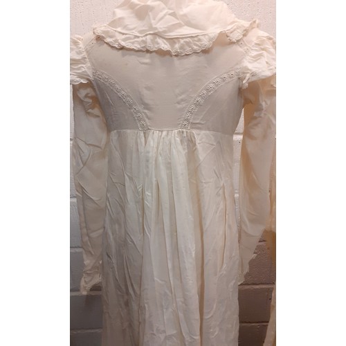 123 - A late 19th/early 20th Century bespoke cream cotton maternity night gown with a central section havi... 