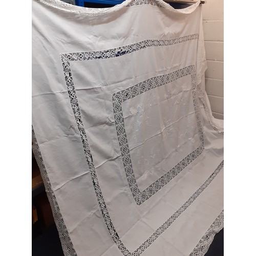 124 - An early 20th Century very large white cotton tablecloth with crotchet insertions 235cm x 290cm (goo... 