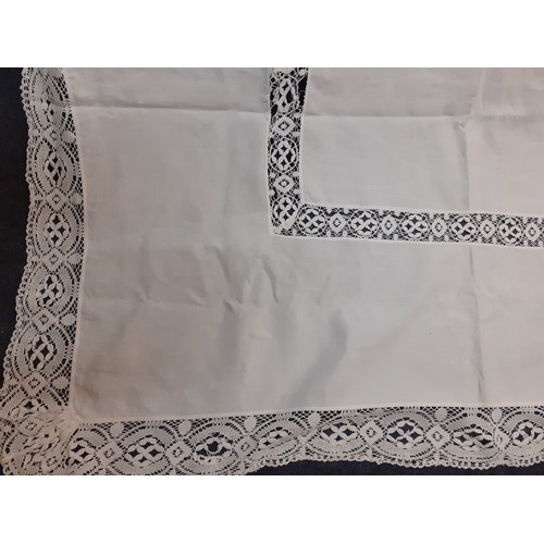 124 - An early 20th Century very large white cotton tablecloth with crotchet insertions 235cm x 290cm (goo... 