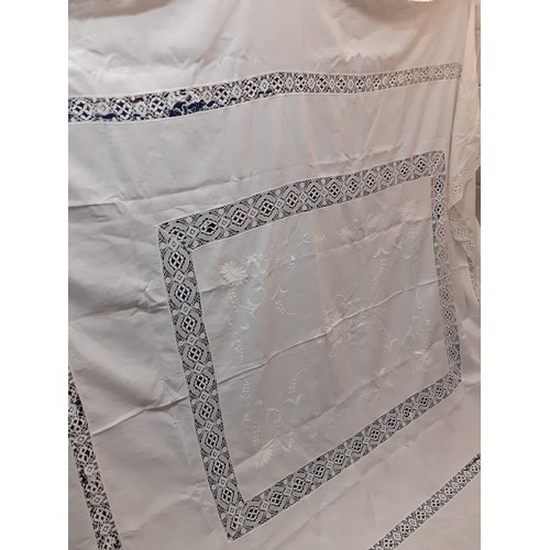 124 - An early 20th Century very large white cotton tablecloth with crotchet insertions 235cm x 290cm (goo... 