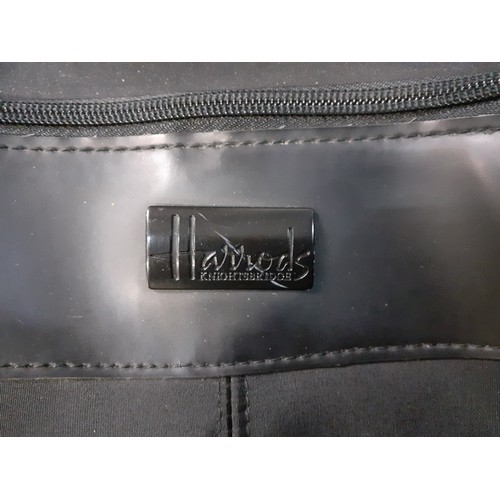 129 - Harrods luggage in black comprising a wheelie bag 28