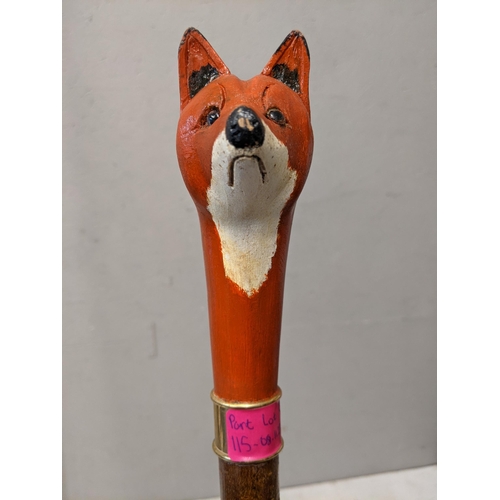 115 - Two hiking sticks and one walking stick, the fox hiking stick and the duck walking stick both made f... 