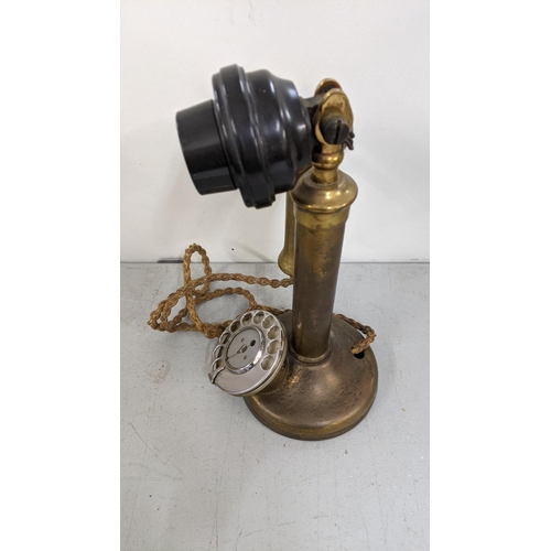 185 - An early/mid 20th century brass candlesticks Rotary dial telephone
Location:11.1