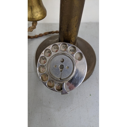 185 - An early/mid 20th century brass candlesticks Rotary dial telephone
Location:11.1