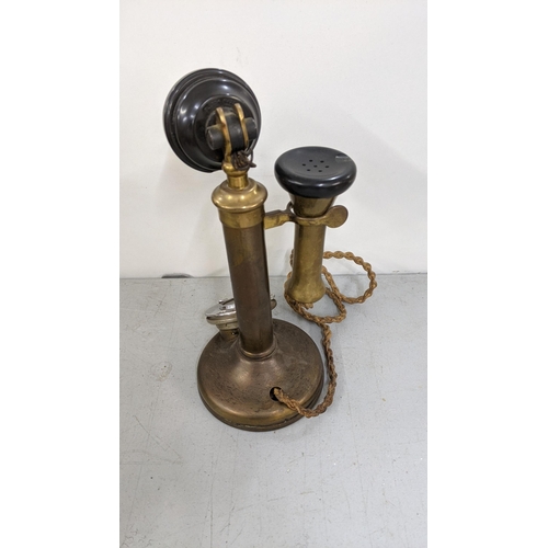 185 - An early/mid 20th century brass candlesticks Rotary dial telephone
Location:11.1