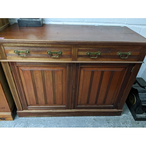 283 - Victorian mahogany side cabinet, two drawer over twin cupboard doors on plinth base, 91 x120 x50cms,... 