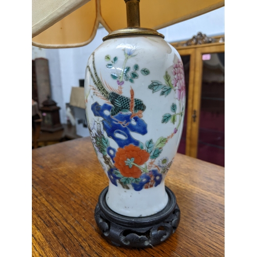 306 - A Chinese late Qing dynasty porcelain vase, converted on a table lamp, fanciful bird perched amongst... 