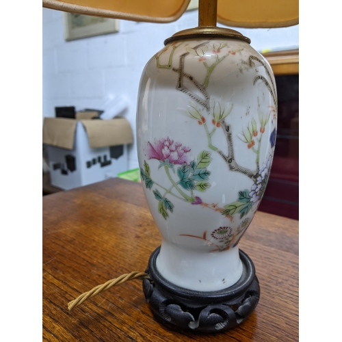 306 - A Chinese late Qing dynasty porcelain vase, converted on a table lamp, fanciful bird perched amongst... 