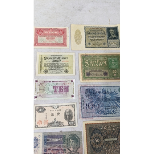 329 - Banknotes to include a French 1792 Revolution, Japanese Government and German examples Location:CAB1