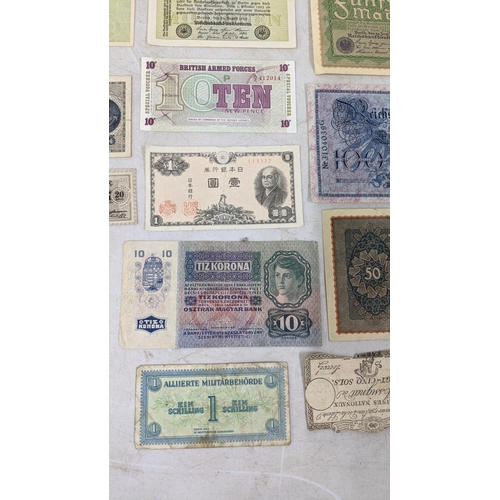 329 - Banknotes to include a French 1792 Revolution, Japanese Government and German examples Location:CAB1