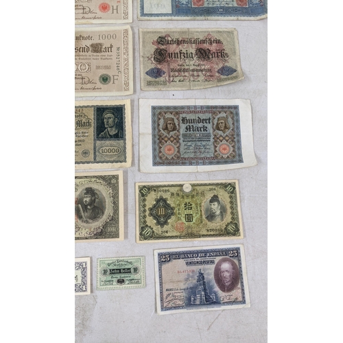 329 - Banknotes to include a French 1792 Revolution, Japanese Government and German examples Location:CAB1