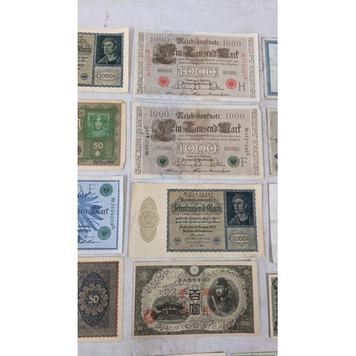 329 - Banknotes to include a French 1792 Revolution, Japanese Government and German examples Location:CAB1