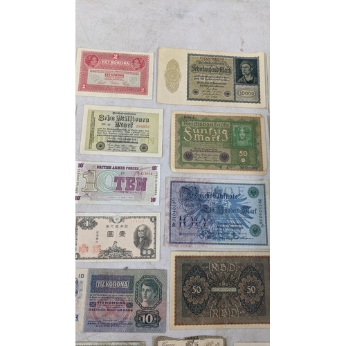 329 - Banknotes to include a French 1792 Revolution, Japanese Government and German examples Location:CAB1