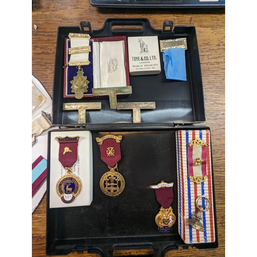 47 - A collection of Masonic related times to include medals, tokens, badges and others along with a name... 