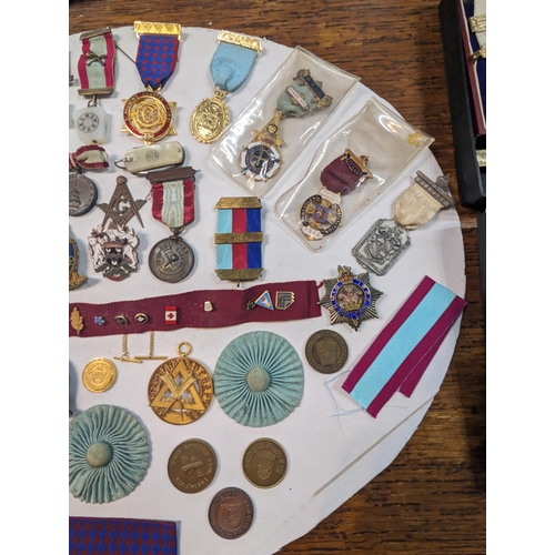 47 - A collection of Masonic related times to include medals, tokens, badges and others along with a name... 