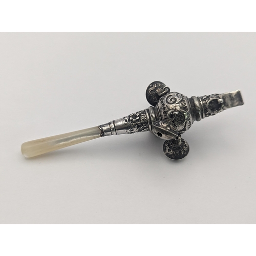 56 - A late 19th/early 20th century white metal baby rattle whistle having a Mother of Pearl handle
Locat... 