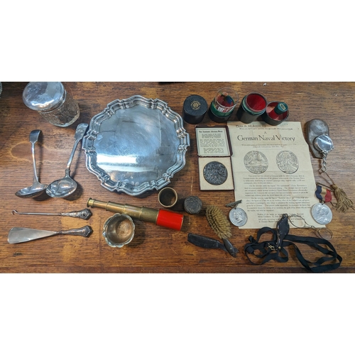 57 - A mixed lot to include silver plated food tray ladles and others along with a boxed Lusitania Medal,... 