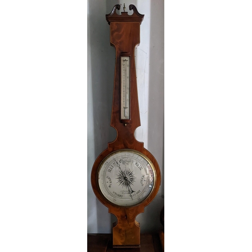 100 - A 19th century mahogany wheel barometer having string inlaid and a silvered dial signed A. Mantegani... 