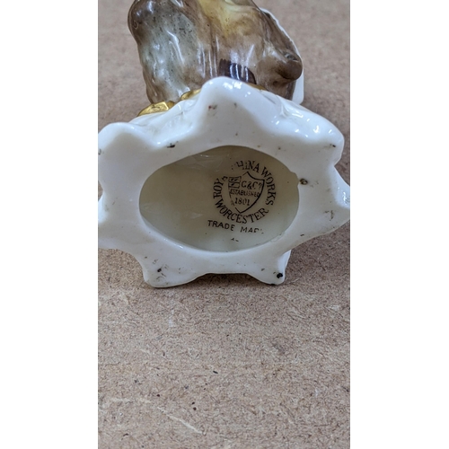 12 - A Royal Worcester novelty candle snuffer modelled as a monkey in a night cap (AF)
Location:4.1