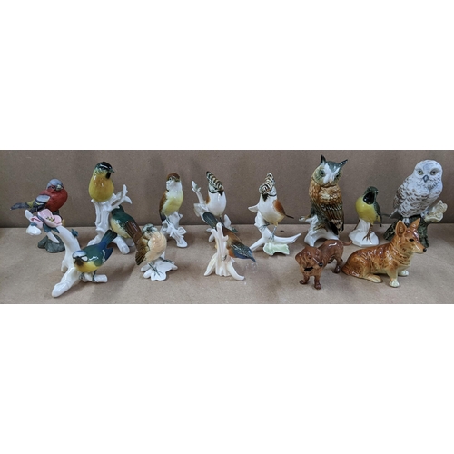 13 - A selection of porcelain animal ornaments to include Karl Ens birds, Bretby style majolica spill vas... 