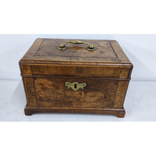 16 - A Victorian mahogany tea caddy having boxwood string inlaid and fitted interior
Location:6.1