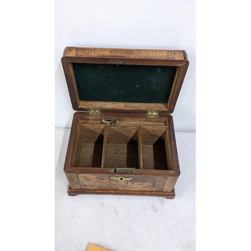 16 - A Victorian mahogany tea caddy having boxwood string inlaid and fitted interior
Location:6.1