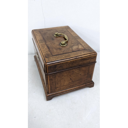 16 - A Victorian mahogany tea caddy having boxwood string inlaid and fitted interior
Location:6.1