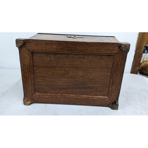 16 - A Victorian mahogany tea caddy having boxwood string inlaid and fitted interior
Location:6.1