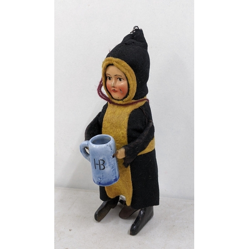 18 - A 1930s Schuco toy of a child drinking monk
Location:4.1