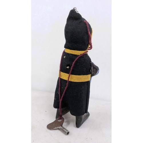 18 - A 1930s Schuco toy of a child drinking monk
Location:4.1