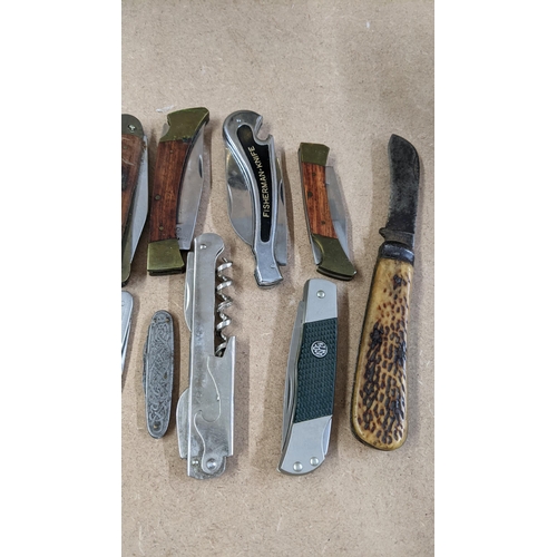 26 - An early 20th century William Rodgers fighting knife together with mixed pen knives including a Blyd... 